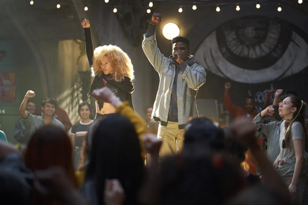 (L to R: Robyn Alomar (Aliyah) and Akiel Julien (Bohdi) perform “My Kin” (Boi-1da Ft. Nikhil Seetharam & The New Babyl Orchestra) for the citizens of New Babyl.  Photo Credit: Russ Martin) 