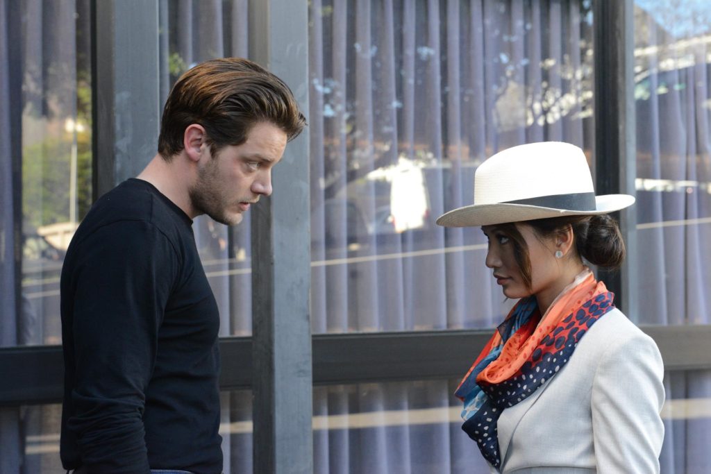 Mason Pollard (played by Dominic Sherwood) and Rina Kimura (played by Jacky Lai) discuss their plan.