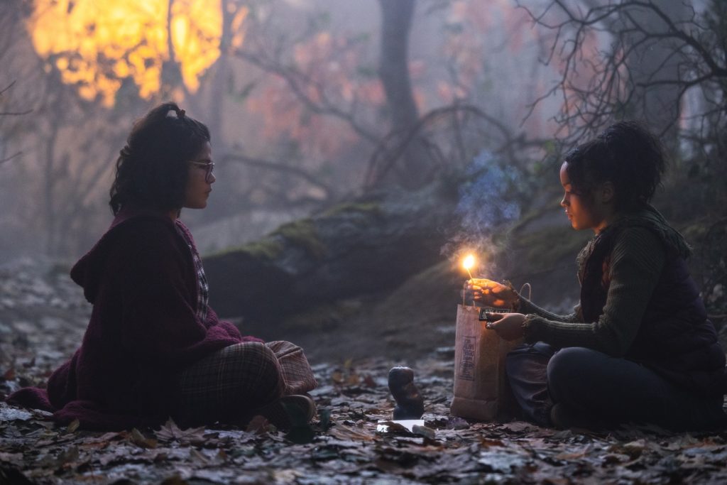 HOCUS POCUS 2 (L-R): Belissa Escobedo as Izzy and Whitney Peak as Becca in Disney's live-action HOCUS POCUS 2, exclusively on Disney+. Photo by Matt Kennedy. © 2022 Disney Enterprises, Inc. All Rights Reserved.