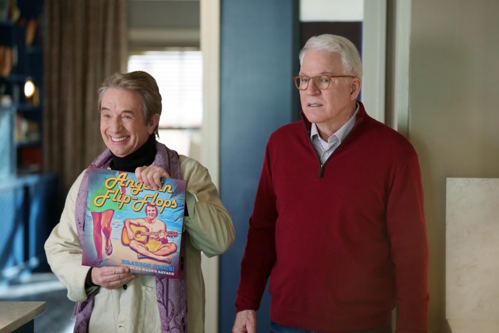 Only Murders In The Building -- “Here’s Looking At You…” - Episode 204 -- Charles, Oliver and Mabel welcome an unexpected young visitor who reveals hidden secrets about the inner workings of the Arconia. We also discover Charles once recorded a hit single that was huge in Germany. Oliver (Martin Short) and Charles (Steve Martin), shown. (Photo by: Craig Blankenhorn/Hulu)